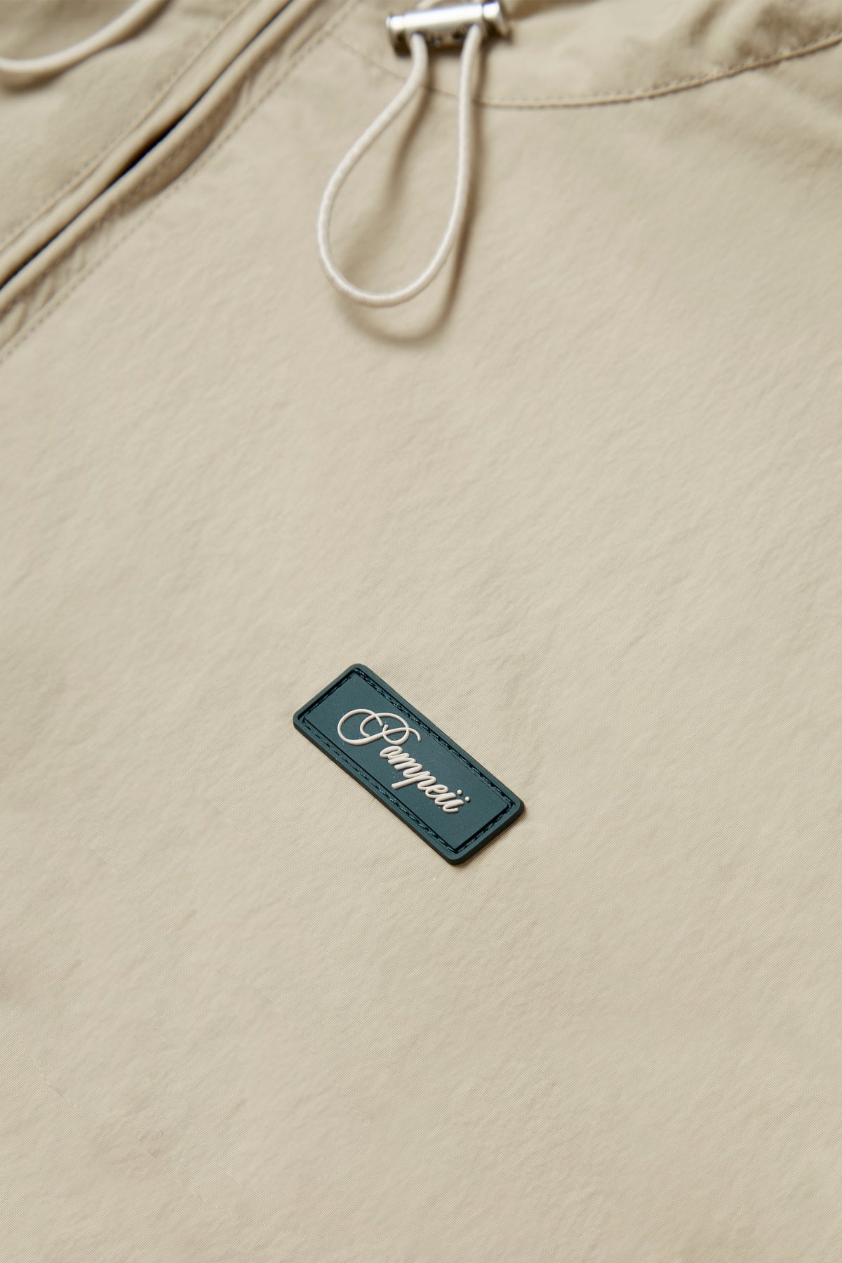 CREAM TECHNICAL WINDBREAKER