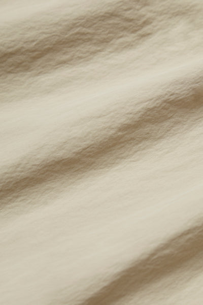 CREAM TECHNICAL WINDBREAKER